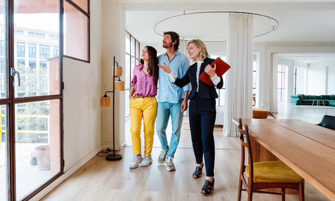 Estate agent showing a waterfront apartment to a couple in Ipswich Waterfront IP3