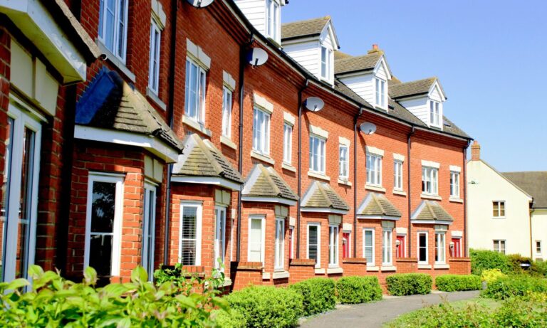 Row of modern red-brick houses, representing Chelmsford house prices and buyer demand in Beaulieu and Old Moulsham.