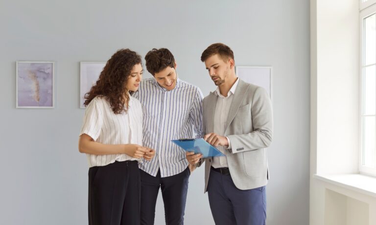 Property consultant advising a couple about buying or renting a home in IP4 Ipswich, one of Suffolk's most desirable residential postcodes.