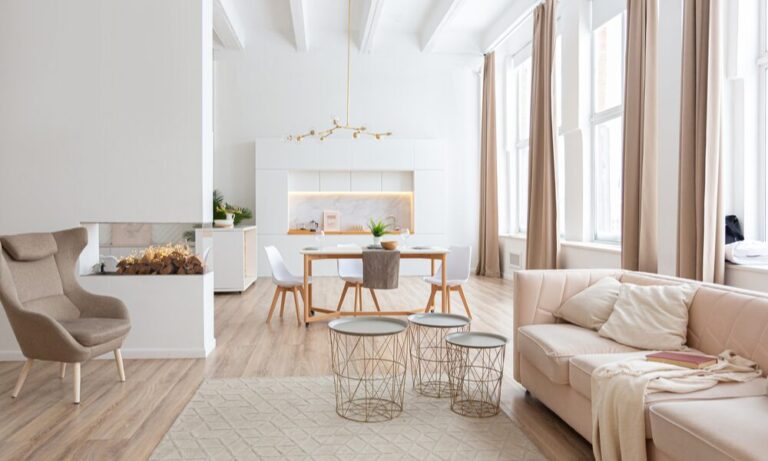 Bright, modern open-plan living and dining area with contemporary furnishings and large windows, showcasing the style of homes that appeal to buyers and renters in the ST16 Stafford area.