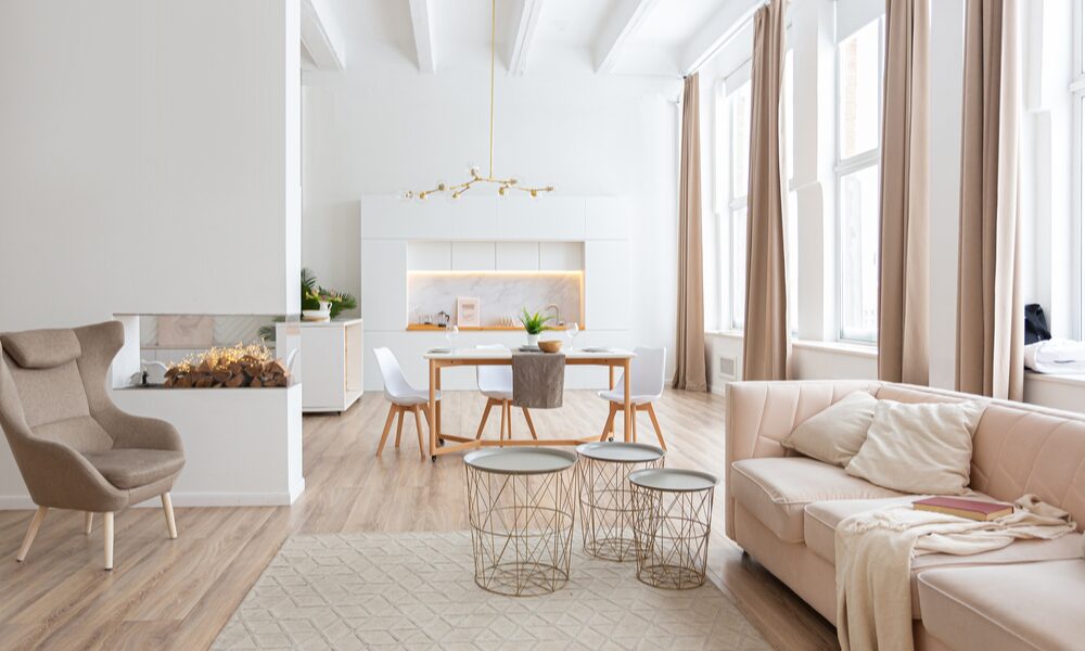 Bright, modern open-plan living and dining area with contemporary furnishings and large windows, showcasing the style of homes that appeal to buyers and renters in the ST16 Stafford area.