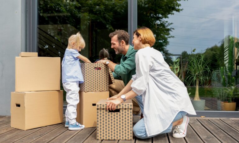 A family moving into a modern home while unpacking moving boxes, illustrating strong demand for quality rental properties in Chelmsford's CM1 and CM2 areas and the opportunities for buy-to-let investors in 2026.